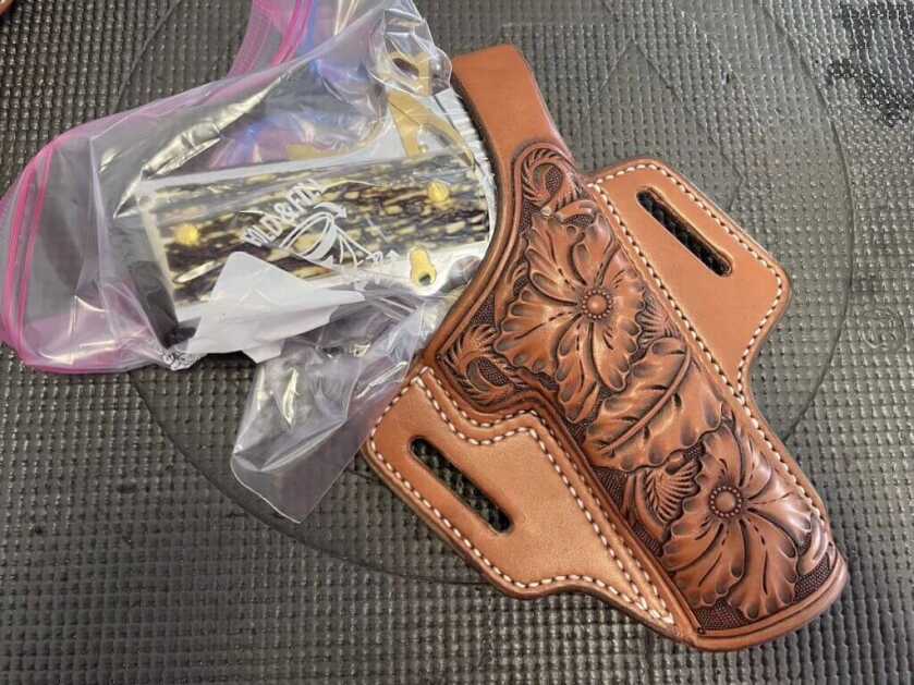  leather holster with gun in bag