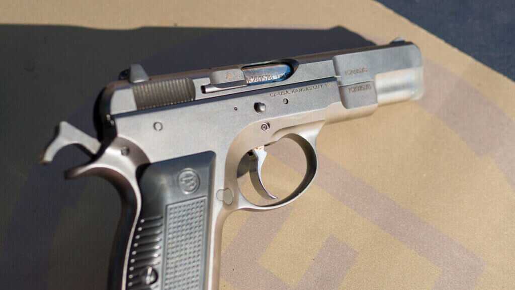 The right side of the gun with the hammer cocked.