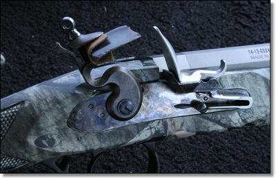 The lock with a fresh new flint tightened in it. This is larger than the flints that are shipped by Traditions these days. The directions that come with the gun ask you to install the flint close to the frizzen, like 1/16th of an inch, but the shorter flints won't come anywhere near that far