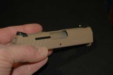 photo 2 The new Novak sight version of the R-1 with a brass bead front sight.