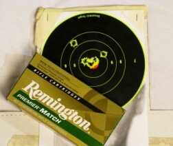 I first got the rifle on paper with some old soft-point hunting ammunition but I used the Remington Premier Match to get a better idea of how the rifle would shoot. The shot that’s up at 11 o’clock was the first round to get sighted in with match ammunition and from there it was a simple correction to bring me down to center. I easily put three in the center dot and then blew the very last shot by pulling it way out into right field, however the 20+ mph winds may have had something to do with it.