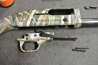 The trigger is easy to remove for cleaning. It is held in by the two pins.