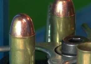 An Introduction to Reloading for Handguns After seating the bullet (left) the case mouth is crimped shut (right) to hold the bullet firmly in place.