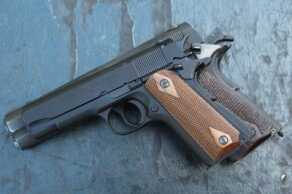 Browning's Miniature Rimfire 1911-22s—New Gun Review The full sized 1911 and the Compact. When placed together like this, it makes the reduction in size look almost insignificant.