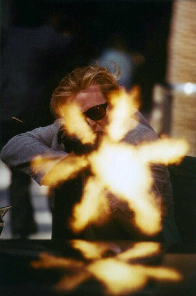 man shooting gun