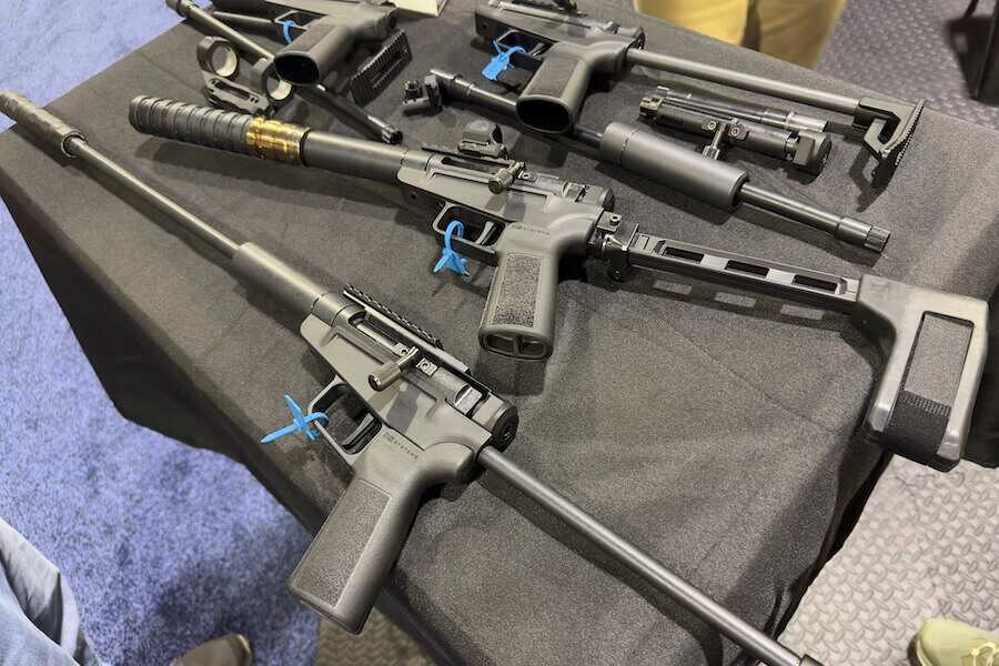 Dark Mountain Arms' Stowaway pistol and rifle on a table.
