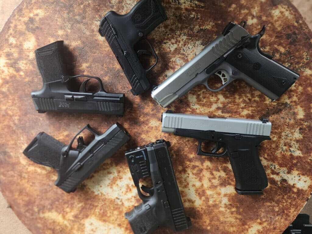 handguns on table