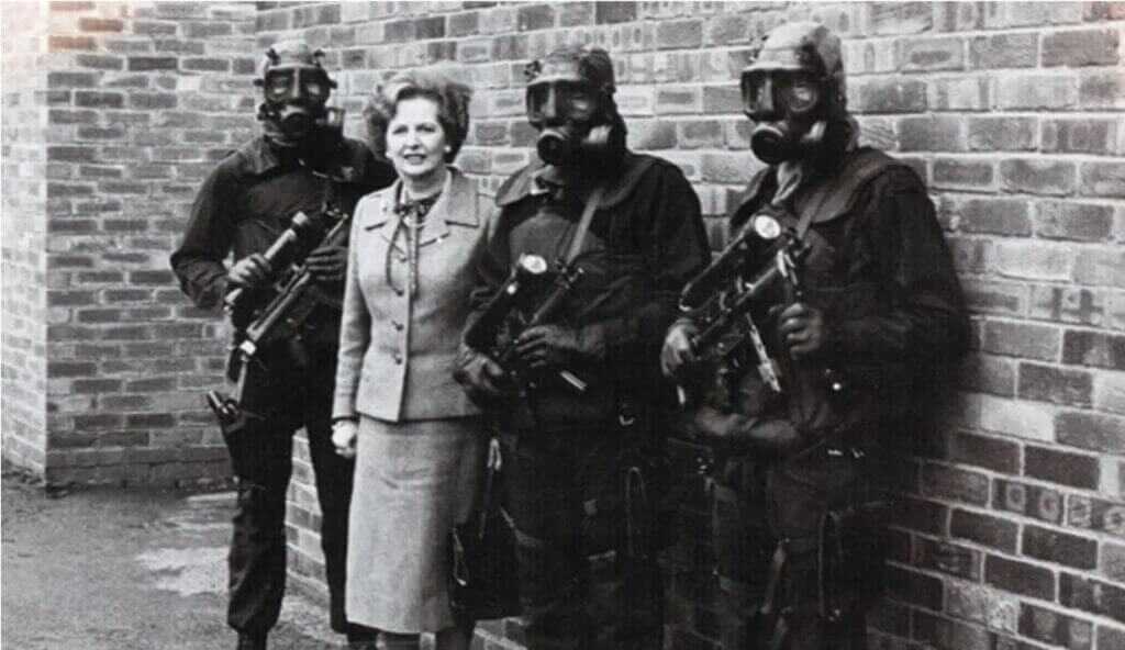 women with men in masks. London