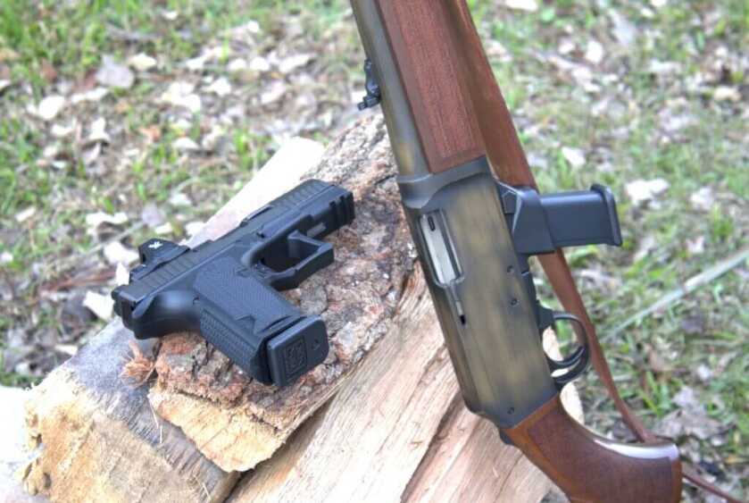 Henry Homesteader M-LOK with optional Glock magazine well beside Glock pistol