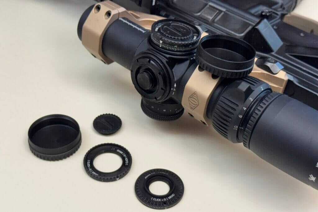 Elevation and windage turrets on Vortex AMG 1-10x24 showing split rings for dual mechanical zeros