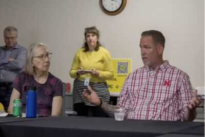 Nebraska U.S. Senate candidate Dan Osborn speaks during a town hall discussion, explaining a proposal that would require owners of certain semi-automatic rifles to undergo periodic mental health evaluations and firearm re-registration.