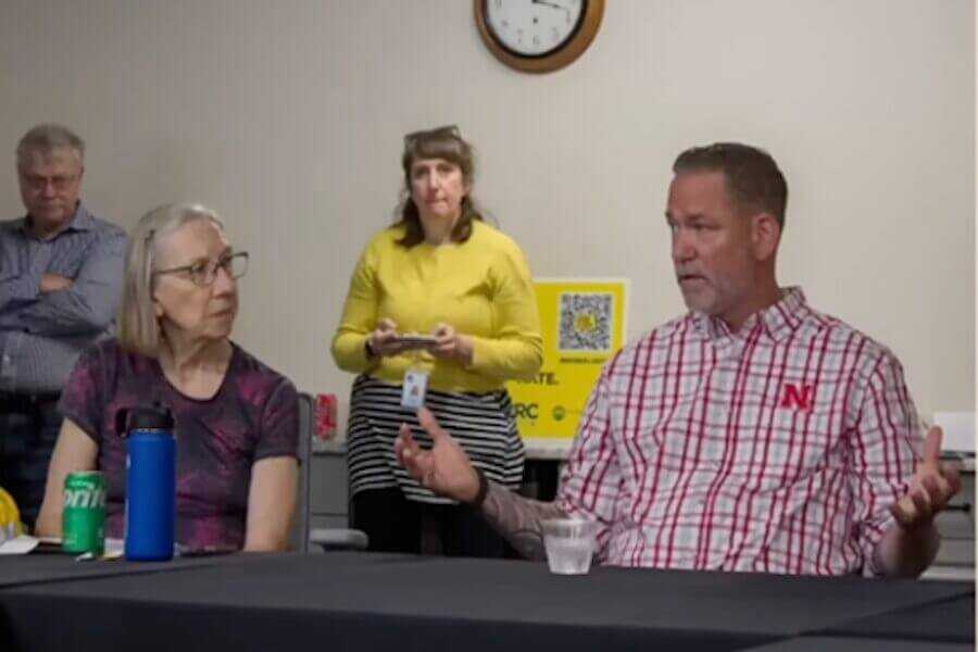 Nebraska U.S. Senate candidate Dan Osborn speaks during a town hall discussion, explaining a proposal that would require owners of certain semi-automatic rifles to undergo periodic mental health evaluations and firearm re-registration.