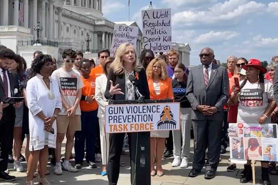 An anti-gun democrat stands at the podium.