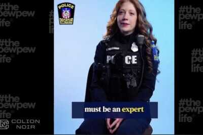 A Decatur, Illinois police officer appears in a recruitment video discussing firearms qualification standards, which Colion Noir critiques in a recent commentary.