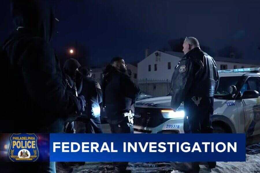 Philadelphia police officers speak with armed members of the Black Lion Party during a January 2026 confrontation that later prompted a U.S. Department of Justice investigation into the city's gun permit revocation practices.