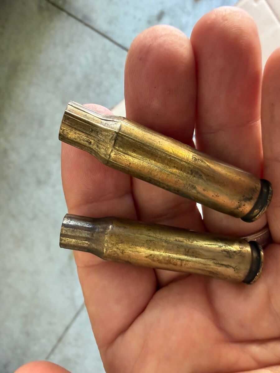 Dented brass cases with chamber flute marks after firing from a PTR HK G3 clone