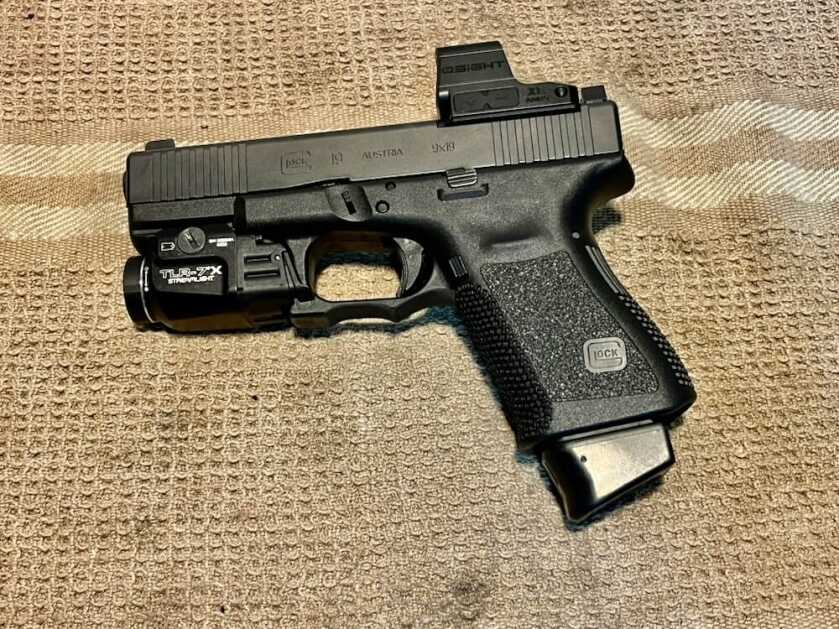 Glock 19 Gen 3 striker fired pistol illustrating modern handgun action design