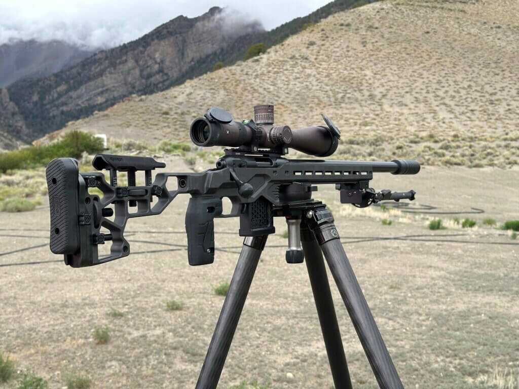 Savage 110 RF Elite Precision suppressed .22 LR varmint rifle on a tripod during extended-distance field testing
