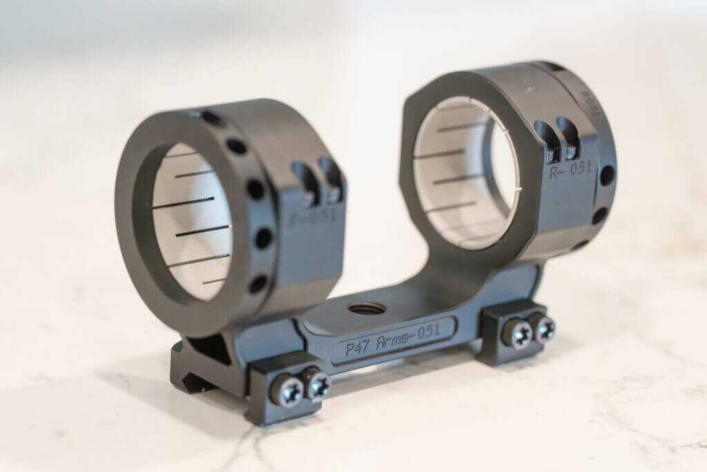 Numbered Project 47 Force 360 scope mount components arranged for installation and reassembly