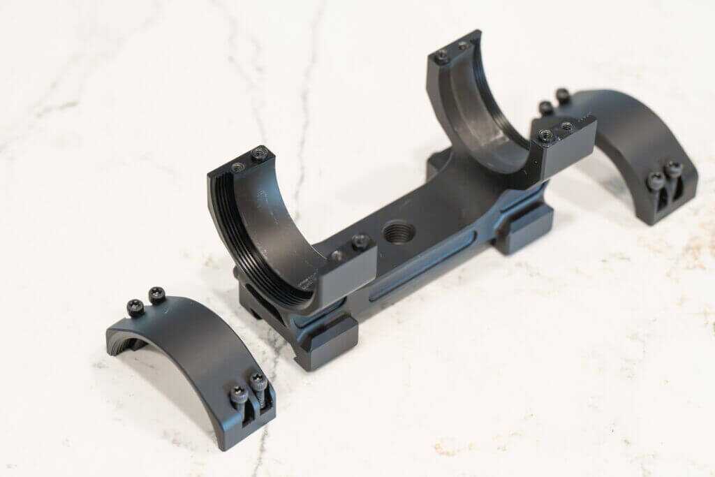 Project 47 Force 360 segmented collet system surrounding a scope tube for 360-degree clamping