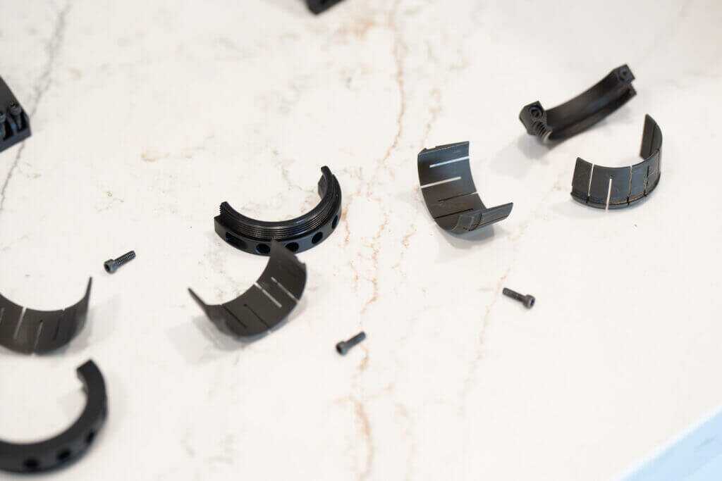Steel segmented collets used inside the Project 47 Force 360 scope mounting system