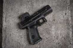 A Steiner MPS 2.0 enclosed-emitter red dot mounted on a full-size optics-ready pistol resting on a concrete surface.