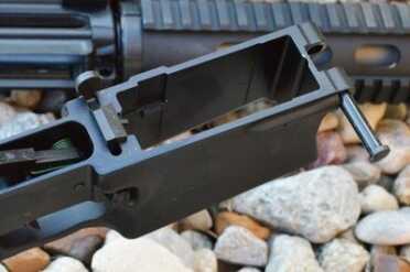 The mag well accepts steel, aluminum, and polymer magazines. 