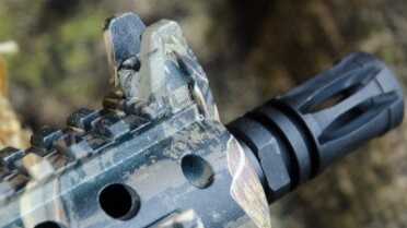 Mossberg 715P Duck Commander – Maybe the Coolest Plinker Ever - New Gun Review Front sight is a traditional looking post. The A2-style flash hider is a nice touch to the look of the pistol.