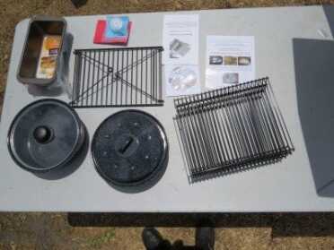 SIG SAUER P556, Short Barrel Rifle Performance from a Pistol - New Gun Review The$399 Sun Oven kit comes with a swinging leveling rack, three stackable drying racks, two pots, two baking pans and directions for everything. The $349 doesn't have the pans.
