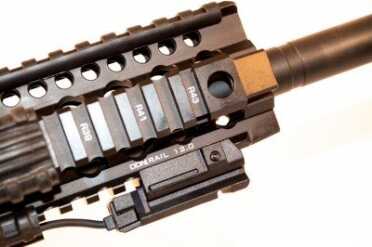 Blackout is the new Black—Daniel Defense DDM4v5 Review The DDM4 rail, shown here with a LaserMax UNI-MAX ES on the bottom rail with remote activation pad on the right side rail.