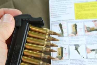 AR-15 Magazine Strip Loading Tool - StripLULA from MagLULA After you slide the strip in, you flip the presser gate over and push down.