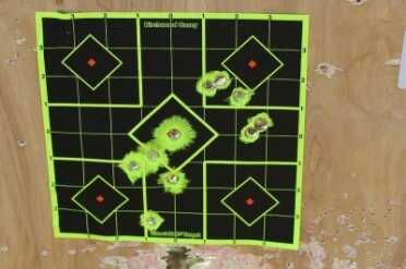 Kimber Master Carry Pro Two magazines from two shooters at 25 yards. The wider yellow spots show that there's not much backing behind the target.