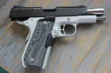 Kimber Master Carry Pro The laser grip switches on (from the other side), is actuated by the shooter's middle finger, and illuminates the target from the top of the grip.