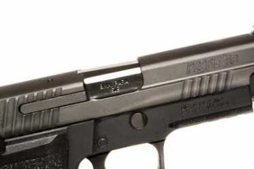 Sig Sauer's Single Action Sensation: The P226 Elite SAO The beefy extractor is on the outside.