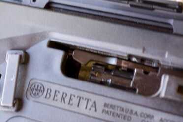 The bolt handle in the maintenance position - also half way to reversing to the opposite side.