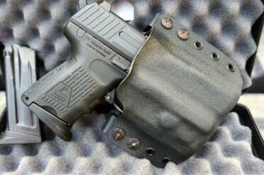 H&K's Sub Compact P2000sk--Where's the Love? A repurposed Multi Holster, complete with the ECR magnet system makes an effective way to carry.