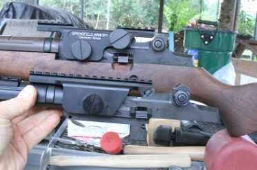 M1A Sniper - On the Cheap, or All the Way? The bottom picture here is the UTG mount and the top one is the Springfield. They mount slightly different and the UTG is much lower, and lacks an easy on-off as well as specific windage adjustment.