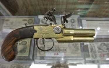 This is a funky little guy!  3 barreled flint lock pistol.