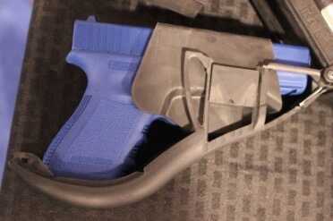 Is That a GLOCK in Your Stock--SHOT Show 2015 You can see the holster part that is dovetailed in. This can be changed for other pistols.