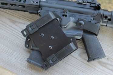 Everyone Needs an AR Holster The mount allows for attaching the holster to MOLLEE or to a belt.