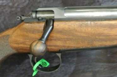 3 New Sauer 101s--SHOT Show 2015 Artemis. The round bar on the rear of the receiver is the safety, it flips up and down.