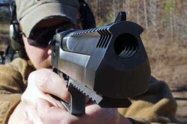 New All Stainless Desert Eagle--Gun Review The compensator takes some of the bite off of the muzzle flip.