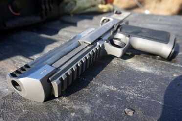 New All Stainless Desert Eagle--Gun Review The fixed barrel allows for more weight to remain forward. If the whole slide moved back, it would be ridiculous.