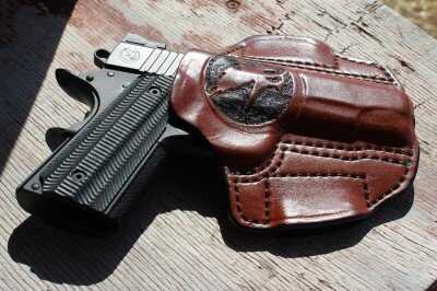 The Single Stack 9mm Perfected--Nighthawk T4 The Nighthawk guns often come with custom holsters. This one has the Nighthawk logo prominently embossed on the front.