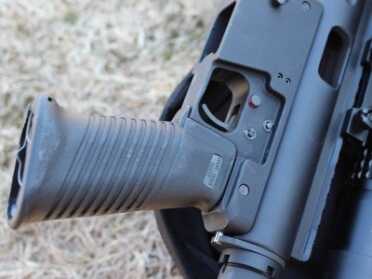 A Carbine in a Backpack--TNW Survival Rifle Review The lower resembles an AR, but the safety is a cross-bolt style.