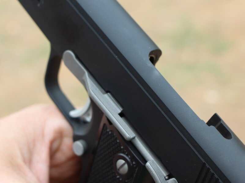 .357 Shoot-off--Coonan Vs. Python If you're right handed, as most of us are, you have to keep your left thumb clear of the slide stop. If you bump it up, the gun locks open, like this.