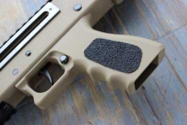 A True Masterpiece? The Masterpiece Arms 30DMG The sides have grip-tape panels for grip.