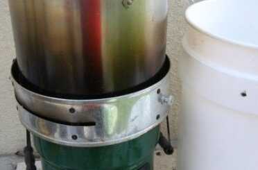 Prepping 101: Water Distillation Still -Is it Worth the Trouble? The Rocket Stove makes a mess of the sides and bottoms of pots, but it works.