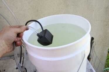 Prepping 101: Water Distillation Still -Is it Worth the Trouble? The water runs to an electric pump. For survival, this type of still is probably not as good as a coil type, but if you have a solar system it certainly doesn't take that many watts to run the small fish tank pump.