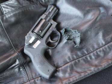 Shooting Revolvers and Autos From the Pocket The perfect pocket pistol? At least for firing from inside a coat. This Smith has a laser, too--though it doesn't do you much good inside the pocket.